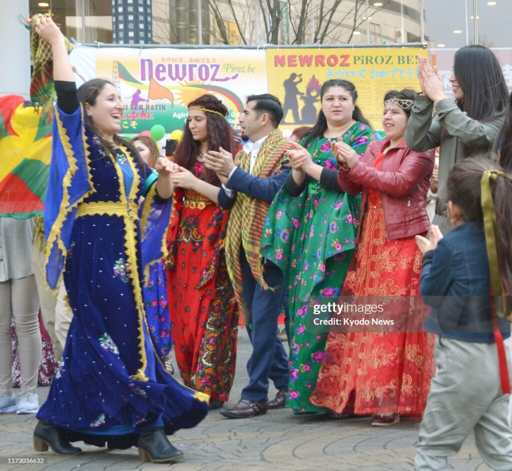 Kurdish women dance in celebration of the traditional Iranian peoples' New Year holiday of Newroz in Kawaguchi near Tokyo on March 20, 2017. (Photo by Kyodo News via Getty Images)