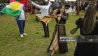 Kurdish people dance in celebration of their traditional New Year holiday of Newroz in Saitama near Tokyo on March 21, 2023. (Photo by Kyodo News via Getty Images)