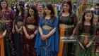 Kurdish people offer silent prayers for the victims of the February earthquake in Turkey and Syria during their traditional New Year holiday of Newroz in Saitama near Tokyo on March 21, 2023. Many Kurdish people living in Japan hail from the areas affected by the earthquake. (Photo by Kyodo News via Getty Images)