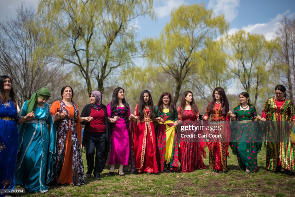 TOKYO, JAPAN - MARCH 24: Kurdish women dance during Nowruz celebrations on March 24, 2018 in Tokyo, Japan. Nowruz meaning 'new day' and marking the first day of spring, is widely celebrated by Kurdish communities around the world including in Japan where an estimated 2000 Kurds reside, many of whom are claiming refugeeÊstatus owing to alleged human rights abuses in Turkey and Iraq. Although the Japanese government has issued some temporary permits allowing many to stay for years, no Turkish Kurd has ever been received refugee status in Japan, which would allow them to settle permanently.Ê  (Photo by Carl Court/Getty Images)