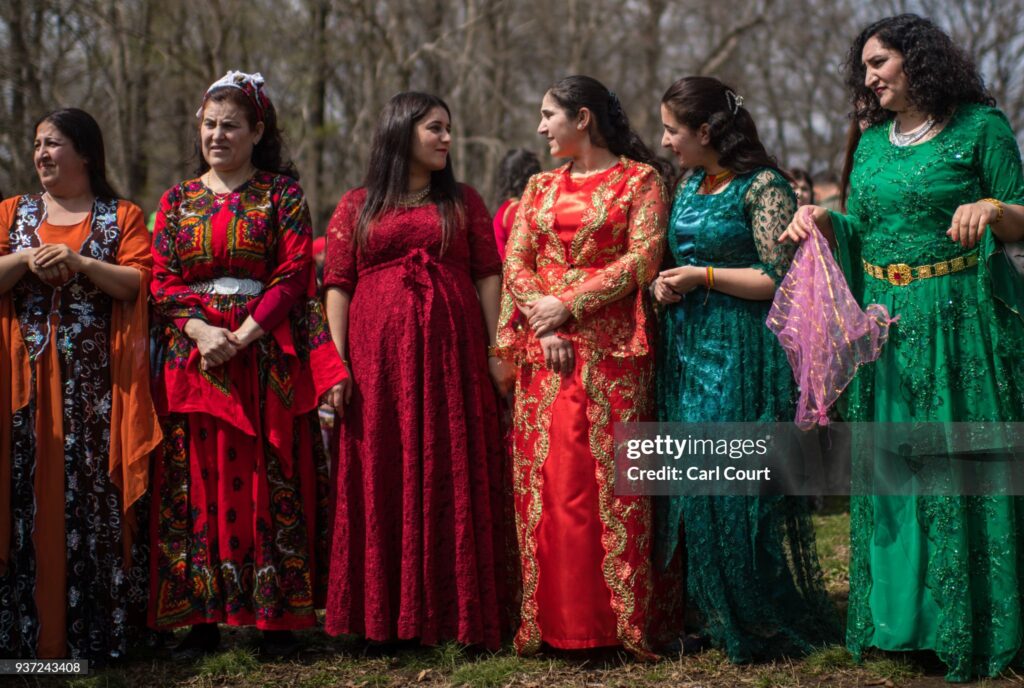 TOKYO, JAPAN - MARCH 24:  Kurdish women chat as they wait to dance during Nowruz celebrations on March 24, 2018 in Tokyo, Japan. Nowruz meaning 'new day' and marking the first day of spring, is widely celebrated by Kurdish communities around the world including in Japan where an estimated 2000 Kurds reside, many of whom are claiming refugeeÊstatus owing to alleged human rights abuses in Turkey and Iraq. Although the Japanese government has issued some temporary permits allowing many to stay for years, no Turkish Kurd has ever been received refugee status in Japan, which would allow them to settle permanently.Ê  (Photo by Carl Court/Getty Images)