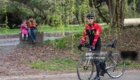 TOKYO, JAPAN - MARCH 24: A cyclist looks on while Kurdish children sit on a bollard during Nowruz celebrations on March 24, 2018 in Tokyo, Japan. Nowruz meaning 'new day' and marking the first day of spring, is widely celebrated by Kurdish communities around the world including in Japan where an estimated 2000 Kurds reside, many of whom are claiming refugee status owing to alleged human rights abuses in Turkey and Iraq. Although the Japanese government has issued some temporary permits allowing many to stay for years, no Turkish Kurd has ever been received refugee status in Japan, which would allow them to settle permanently.   (Photo by Carl Court/Getty Images)