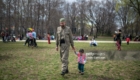 TOKYO, JAPAN - MARCH 24:  A Kurdish man in traditional attire walks with a young child during Nowruz celebrations on March 24, 2018 in Tokyo, Japan. Nowruz meaning 'new day' and marking the first day of spring, is widely celebrated by Kurdish communities around the world including in Japan where an estimated 2000 Kurds reside, many of whom are claiming refugee status owing to alleged human rights abuses in Turkey and Iraq. Although the Japanese government has issued some temporary permits allowing many to stay for years, no Turkish Kurd has ever been received refugee status in Japan, which would allow them to settle permanently. (Photo by Carl Court/Getty Images)
