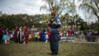 TOKYO, JAPAN - MARCH 24:  A Kurdish man in traditional attire carries a child on his shoulders as he looks on during Nowruz celebrations on March 24, 2018 in Tokyo, Japan. Nowruz meaning 'new day' and marking the first day of spring, is widely celebrated by Kurdish communities around the world including in Japan where an estimated 2000 Kurds reside, many of whom are claiming refugeeæstatus owing to alleged human rights abuses in Turkey and Iraq. Although the Japanese government has issued some temporary permits allowing many to stay for years, no Turkish Kurd has ever been received refugee status in Japan, which would allow them to settle permanently.  (Photo by Carl Court/Getty Images)